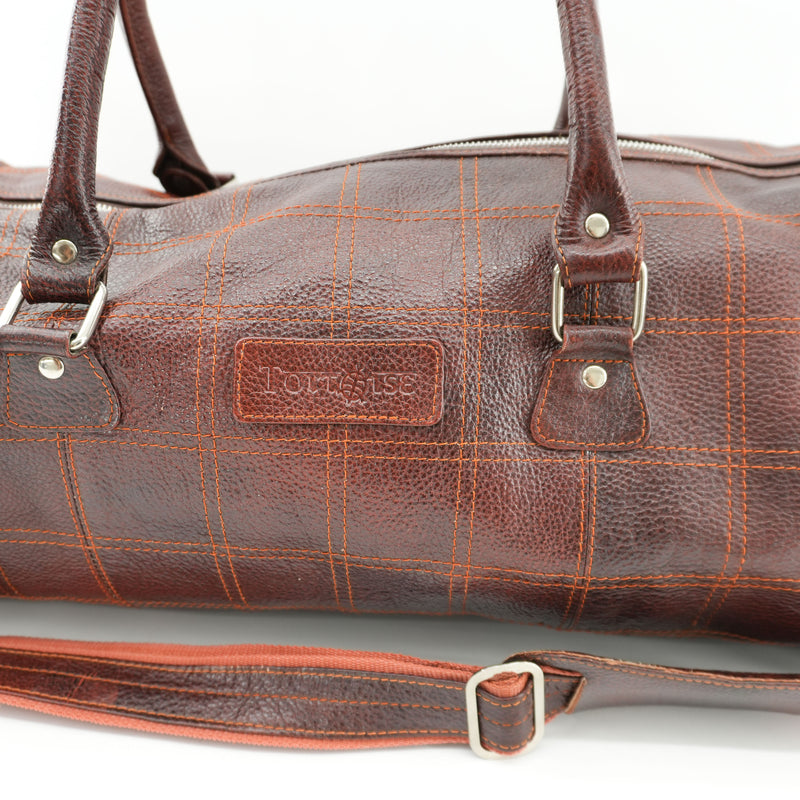 brown-leather-duffel-bag-with-orange-strap-4.jpg