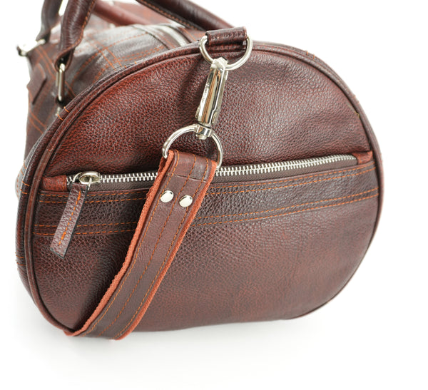 brown-leather-duffel-bag-with-orange-strap-2.jpg
