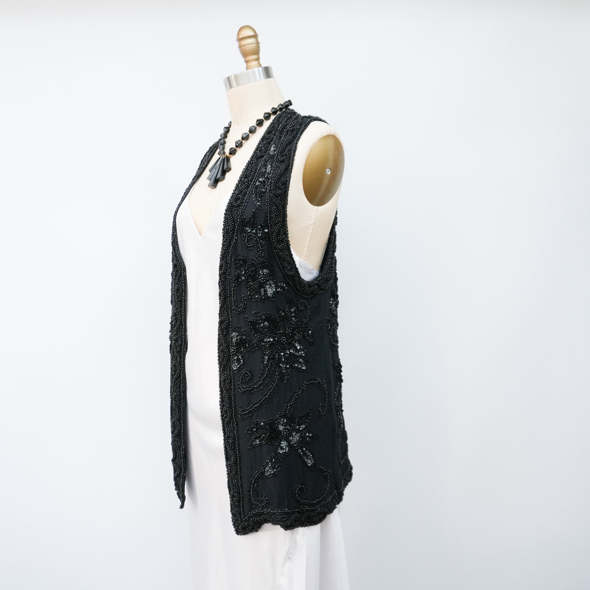 blacksequinedvestwithwhitetopandblackpants-5.jpg