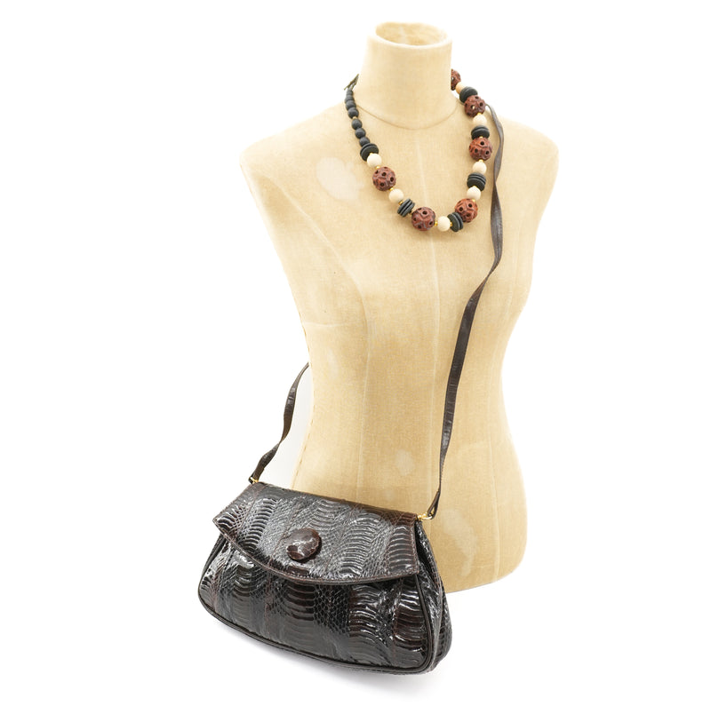 vintagedarkbrownclutchpursewithbeadednecklace.jpg