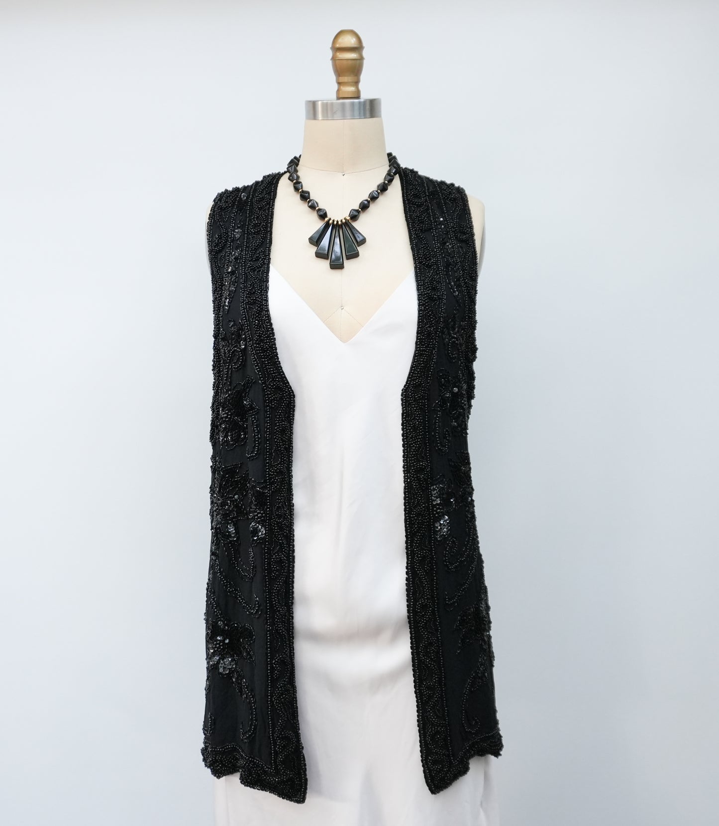 blacksequinedvestwithwhitetopandblackpants-4.jpg