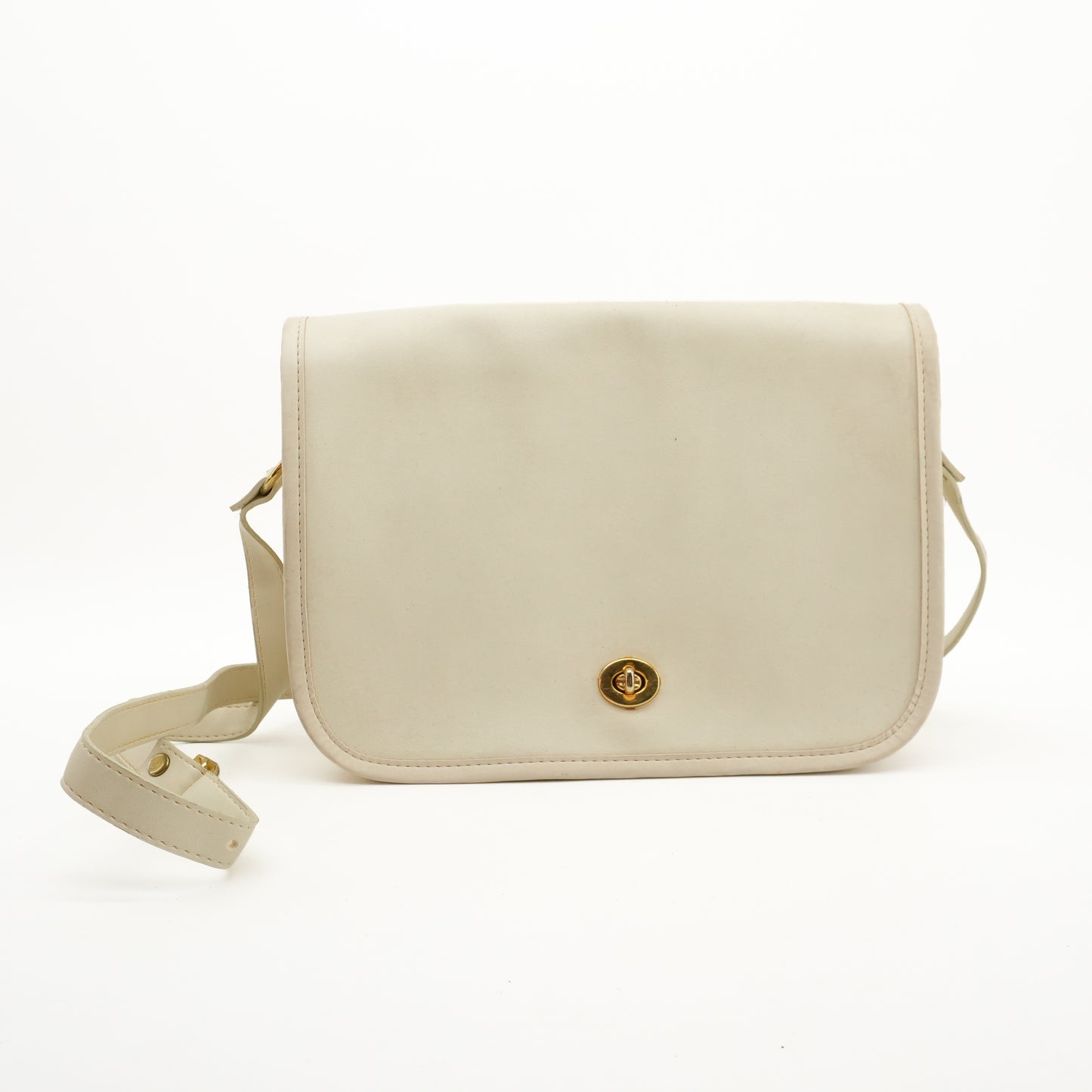 vintagesaddlebagwhiteleathertwistlockcrossbodypurse.jpg