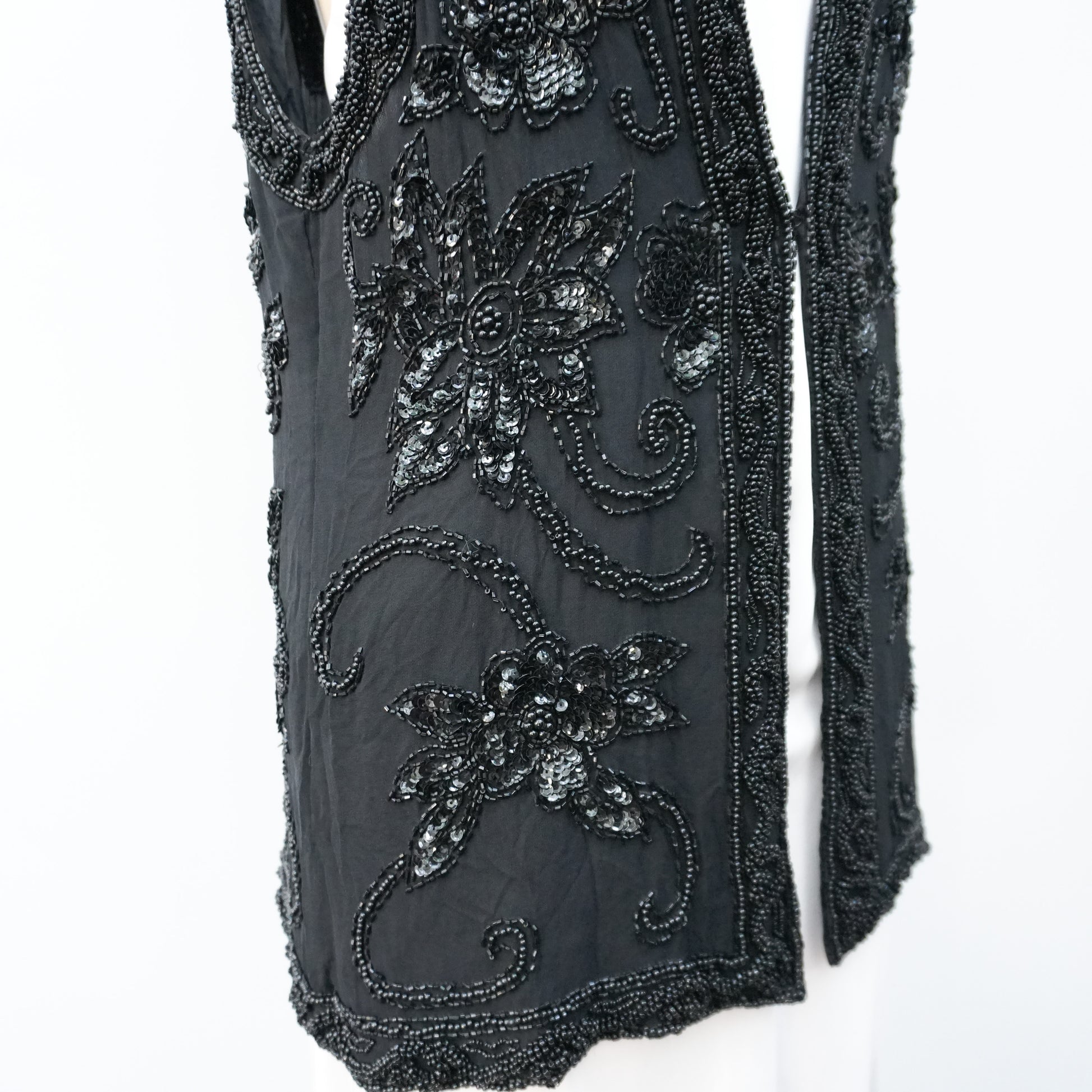 blacksequinedvestwithwhitetopandblackpants-8.jpg