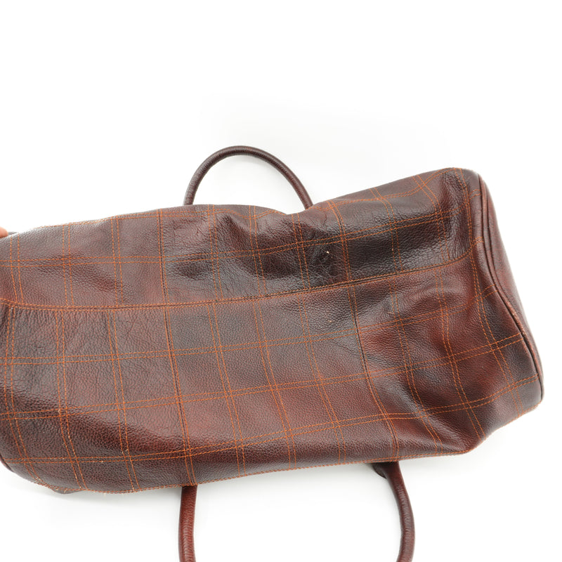 brown-leather-duffel-bag-with-orange-strap-5.jpg