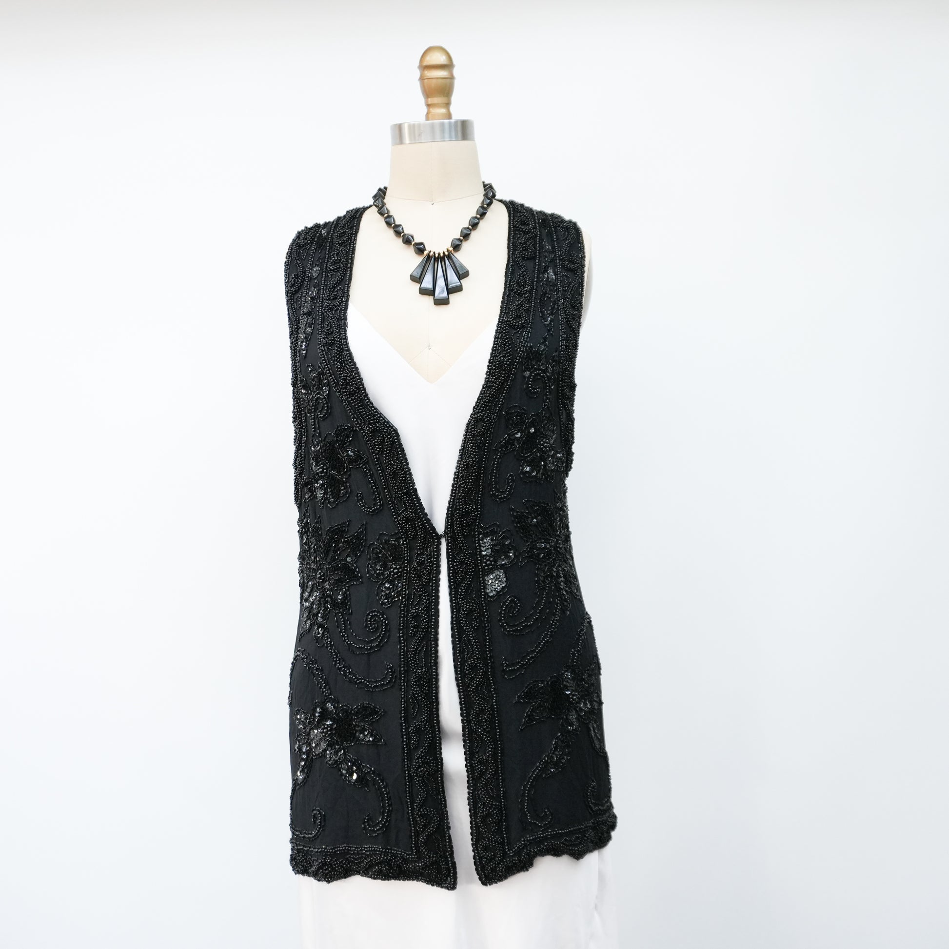 blacksequinedvestwithwhitetopandblackpants-9.jpg