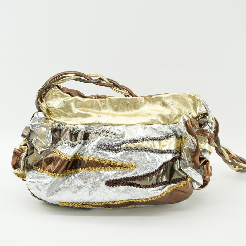goldsilverbrownmetallicbagwithbraidedhandle.jpg